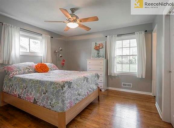 Master bedroom has soft color palette, hardwood floors, double closets and en suite bathroom.