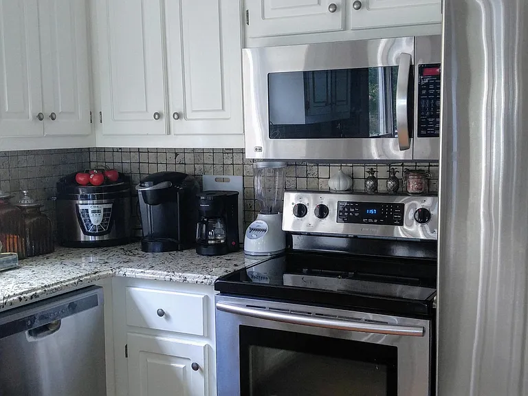 Stainless steel appliances and granite countertops.