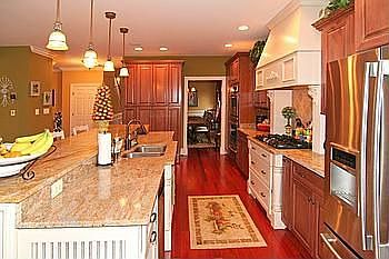 Granite Counters, Brazilian Cherry Hardwoods, Two- Tone Cabinetry, SS Applianc