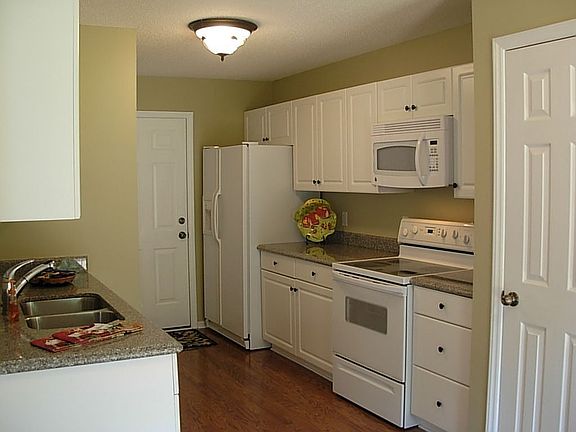 Kitchen w/new granite counters, new appliances include fridge & microwave!