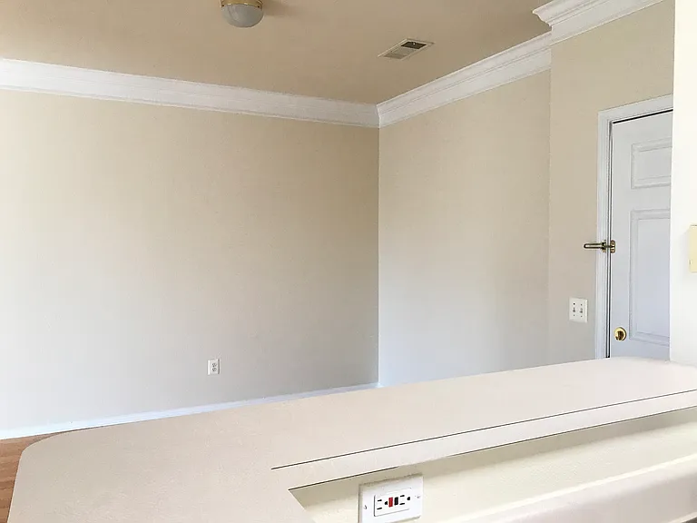 View from kitchen to foyer/dining area