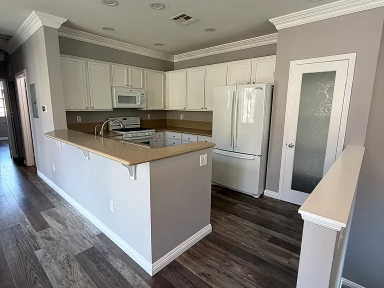 Well-appointed kitchen featuring a brand-new microwave and built-in AquaTru reverse osmosis water filtration system.