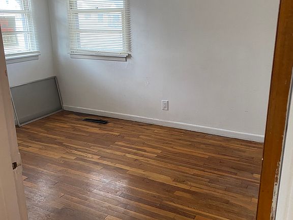 One of two bedrooms with wood floors that ate same as living room.