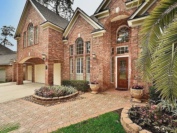 Beautiful curb appeal with professional landscaping.