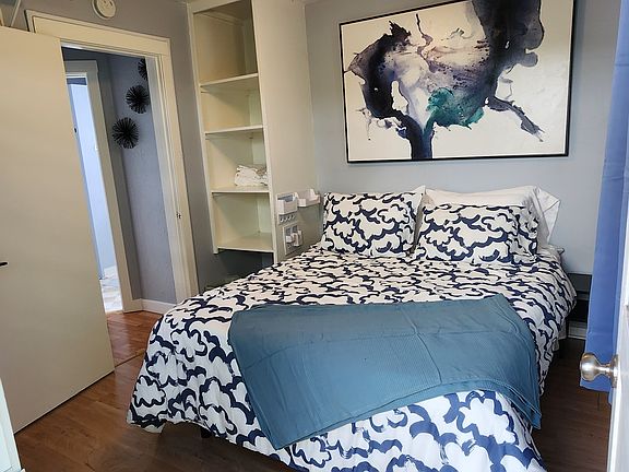 The upstairs bedroom has a door leading to the patio.