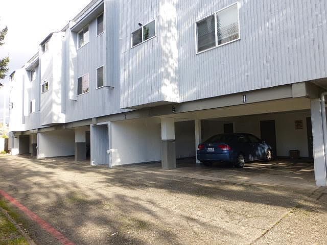 Well maintained building with covered parking and storage units.