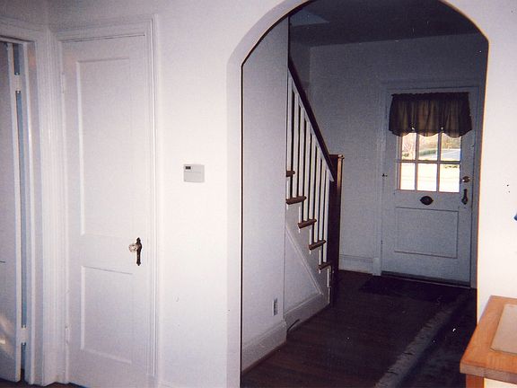 Dining Room with view into Living Room (Linen Closet and doo