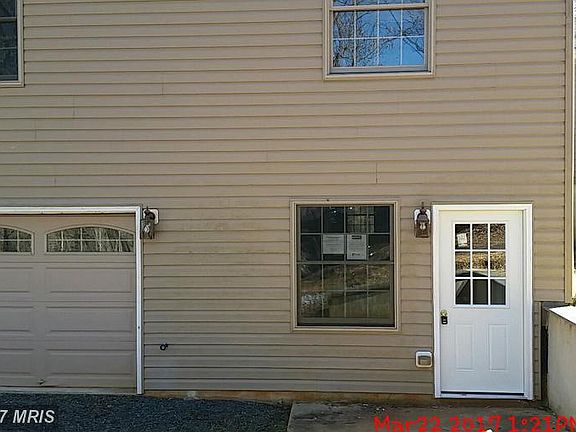 Basement entrance with garage to the left