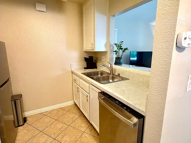 Kitchen- Refrigerator, Dishwasher, Gas Range, dual sinks. Plenty of cabinets space plus pantry.