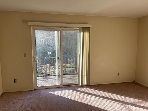 Upstairs bedroom with balcony