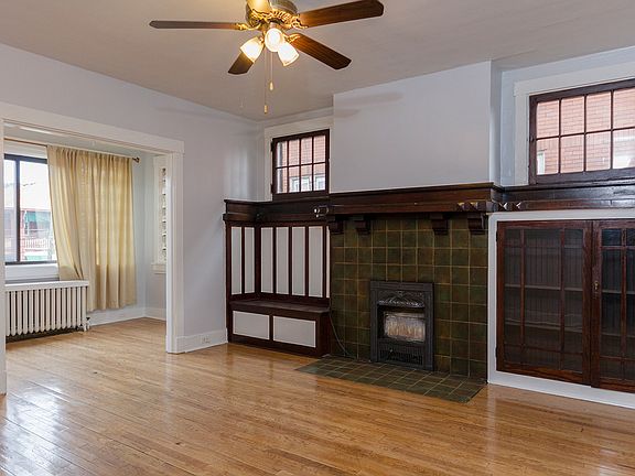 Livingroom, fauex fireplace, built-in cabinets, hardwood flo
