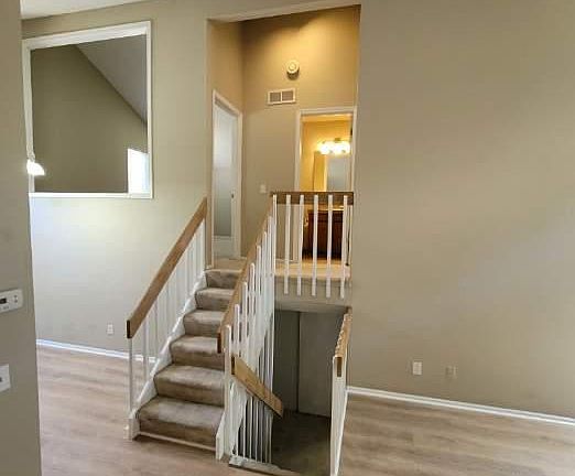 living room view to family room and half bathroom