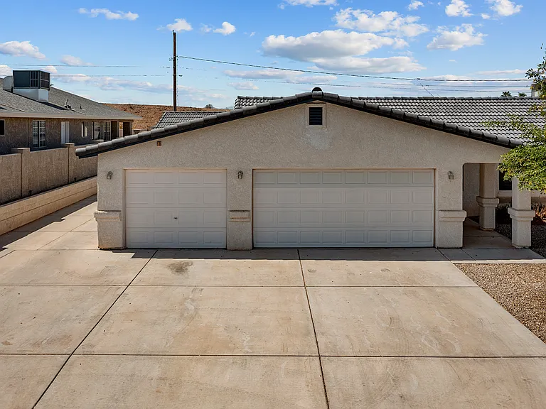 Far left is the Back house driveway. 
All 3 front house garages reserved for Front house tenant. Left side has an entrance to garages as well.