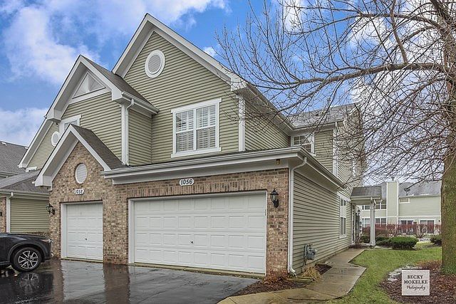 End unit with private entrance / 2 car garage