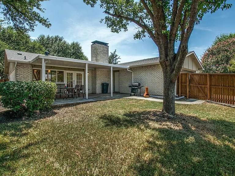 Covered patio and grill provided