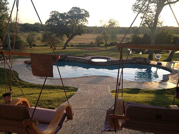 Your pool with .jump rock, heated spa, waterfall and a 21 x 38 decking. Large back porch for dining 