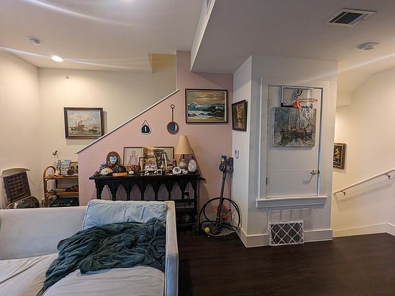 View from kitchen to stairways.