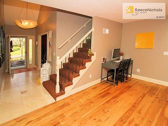 Stair to the upper level and desk area in the great room