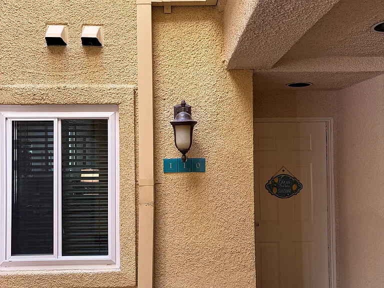 Private front entrance to the condo, providing secure access.