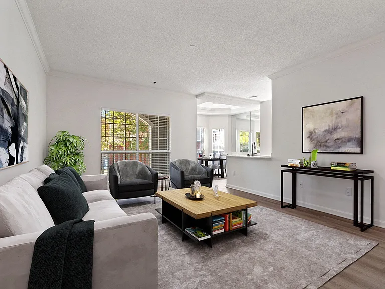 Living room with large floor to ceiling windows that offer an abundance of light