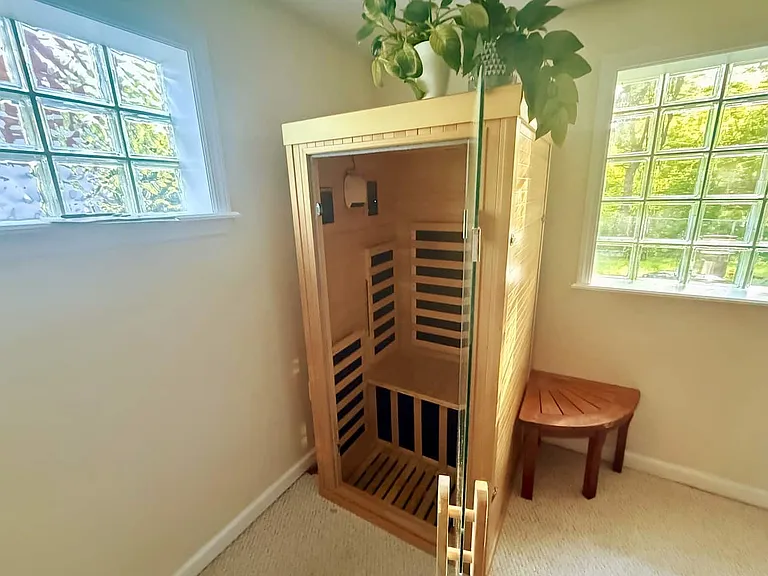 Private infrared sauna included with your lease _ part of a full wellness setup with cold plunge and red-light therapy