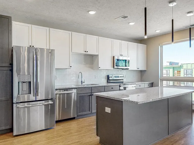 Sleek appliances and plenty of cabinet storage adorn our kitchens.