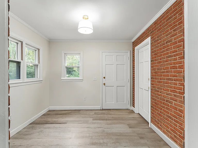 Office/flex room with side entrance to parking area.