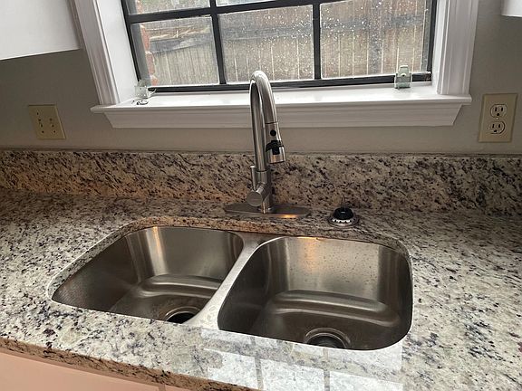 New granite counter tops and faucet.