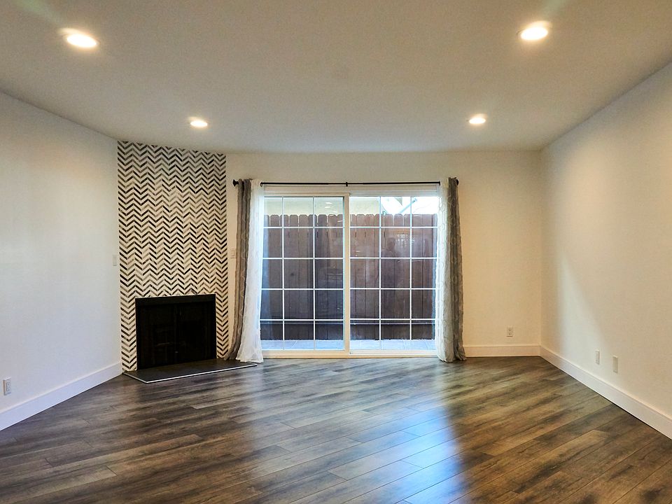 spacious living dining with fire place, recessed lighting throughout