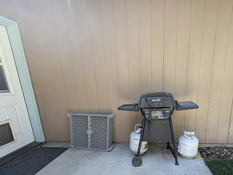 Gas grill, dog door, and dog gate if desired