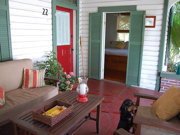 Front porch and view of bedroom through French door