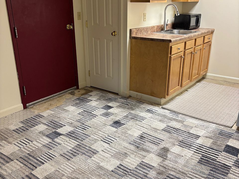 Kitchen with pantry closet and living room