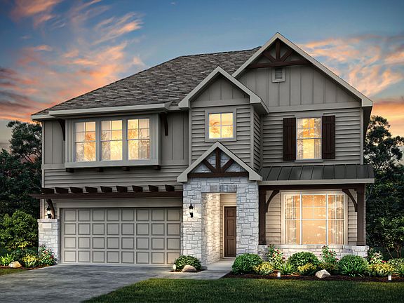 Exterior K, with covered front porch, stone accents, and a 2-car garage