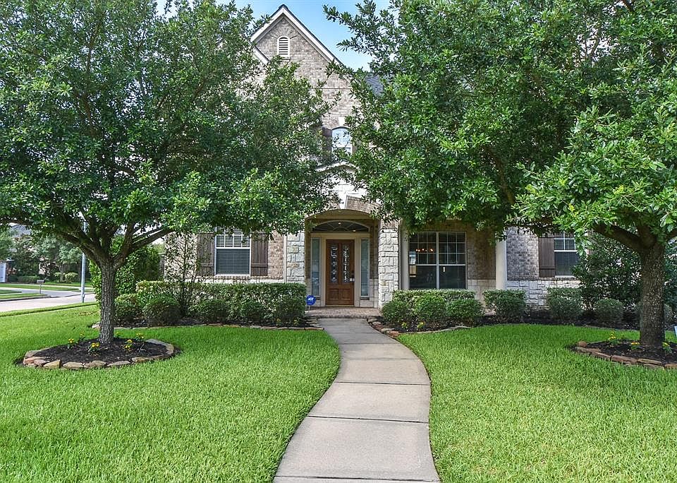 Warm and welcoming brick and stone exterior