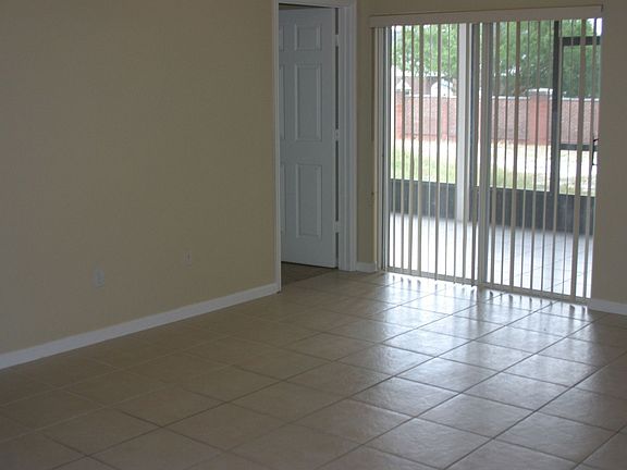 Sliders off Family Room permit access to Covered, Screened-In Porch.
