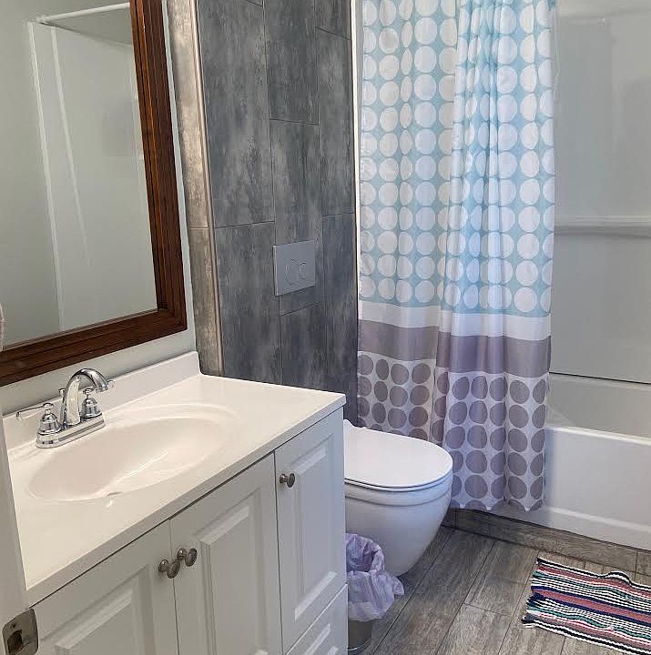 Full bath - tub/shower combo, sink with plenty of cabinet space