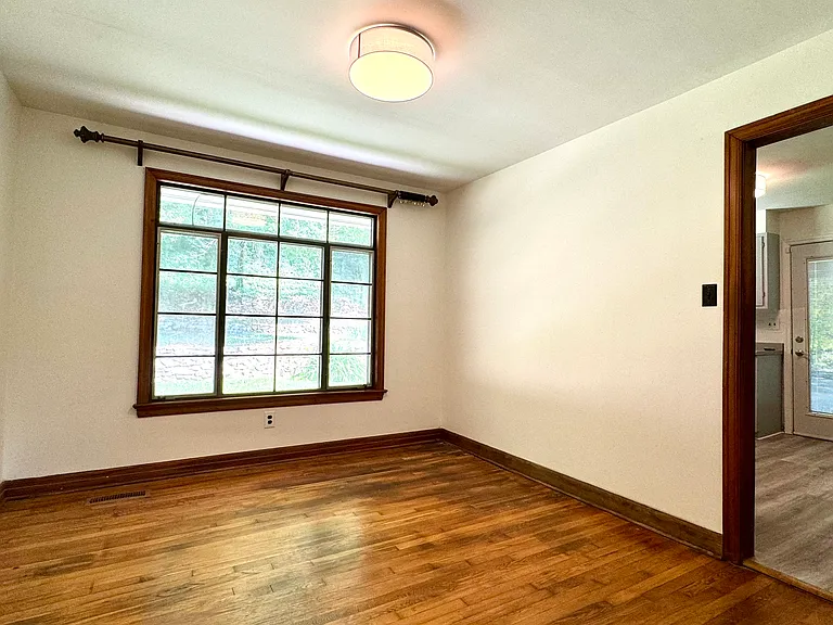 Dining Room with hardwood flooring; looking into Kitchen.