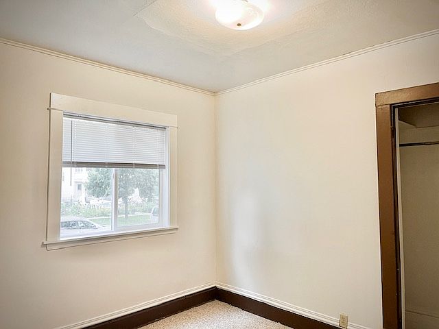 Bedroom 1 has la arge slider window.