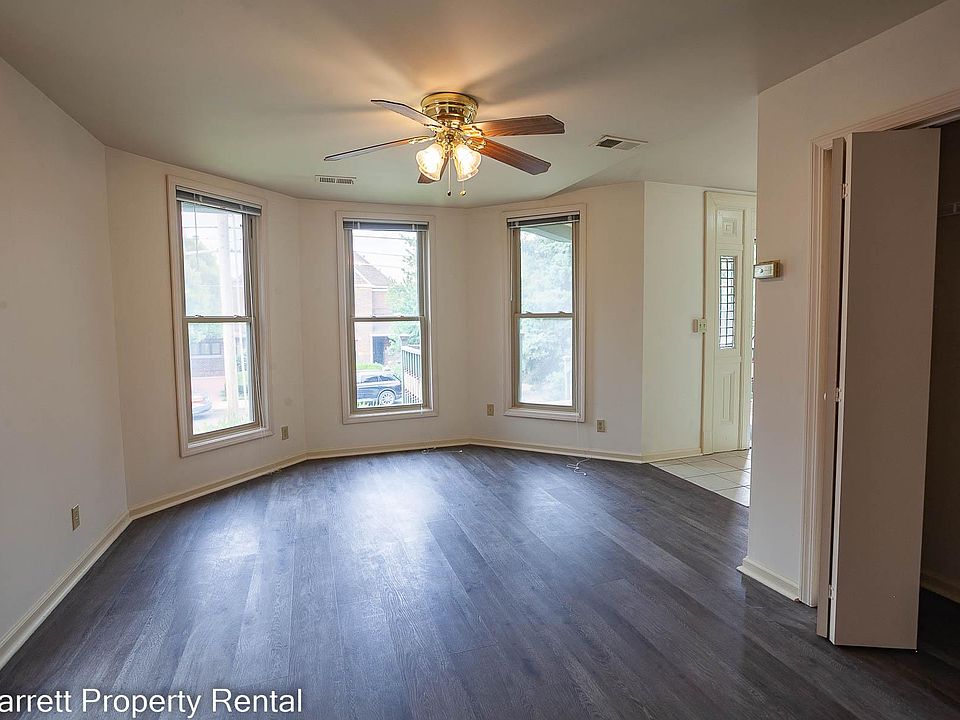 Spacious living room with bay window and bonus closet