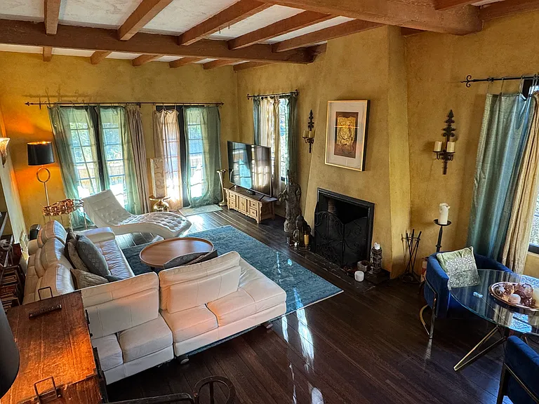 Living room with fireplace and wide screen tv