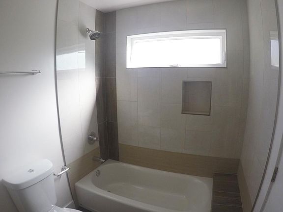 Custom designed shower/tub encosure.