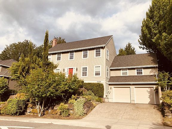Front with easy-to-maintain vegetation. Oversized 588 sqft 2-car garage (level II EV charger installed)