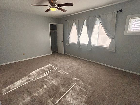 Living room from hall, coat closet.