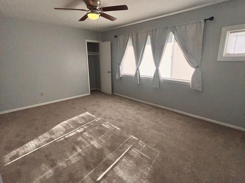 Living room from hall, coat closet.