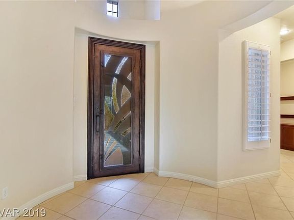 Custom front door matches the courtyard entry gate