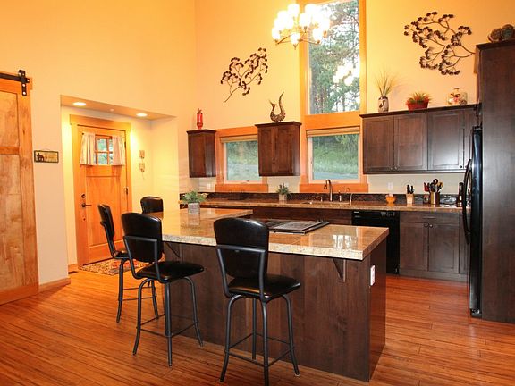 Kitchen has large center island that can accomodate 8 people comfortably. Great for entertaining.