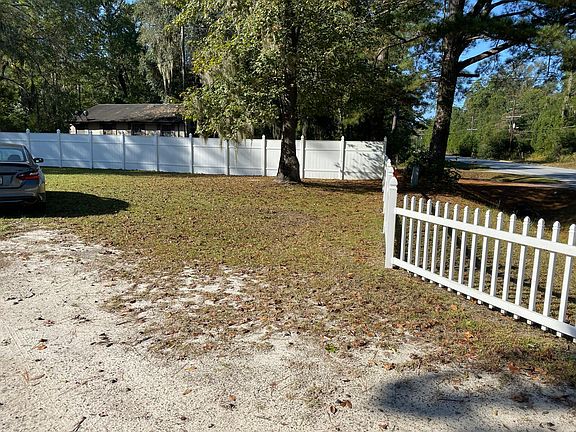 Large yard front and back with fence