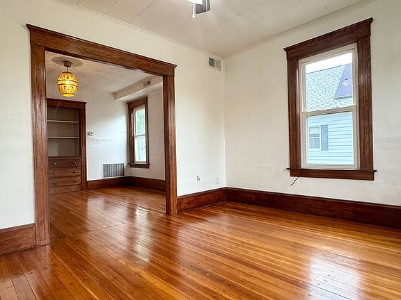 View open concept living room into dining room.