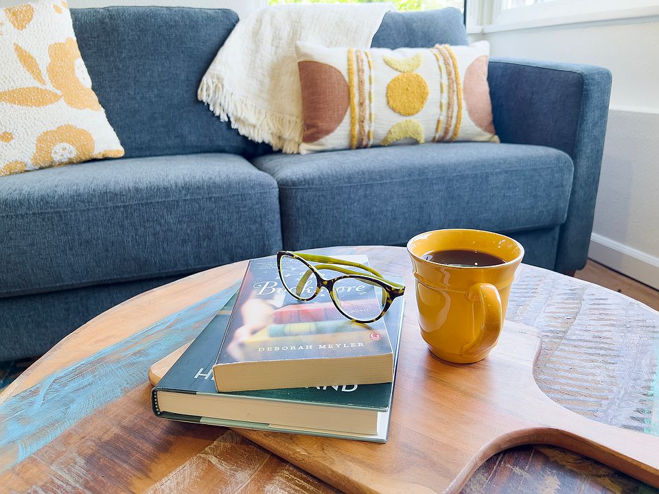 Enjoy a book by the large living room windows.
