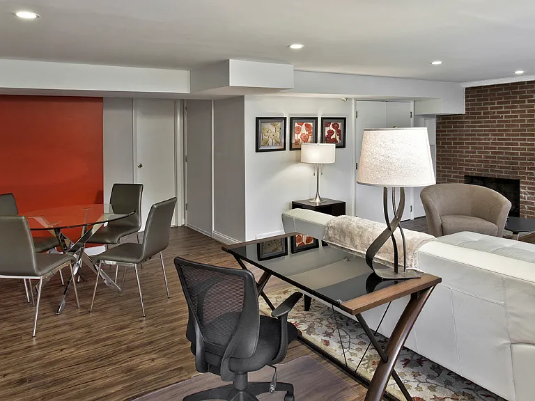 View of dining table, desk and lamp, living room